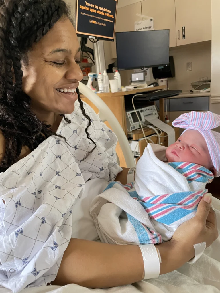 My wife Claudia is pictured holding our new daughter Aaliyah. 